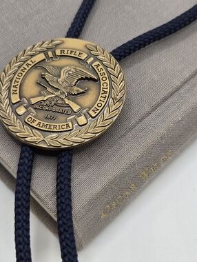NRA National Riffle Association Bolo Tie Brass medallion navy braided cord
